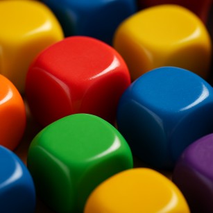 Close-up of colorful dice representing the role of randomness