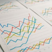 Line graphs and charts showing fluctuating numbers with a playful twist